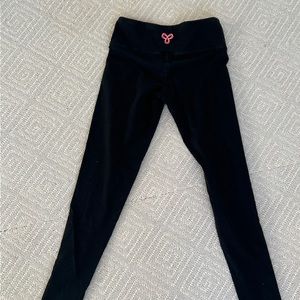 TNA leggings with pink emblem. Used like new. Size Xs